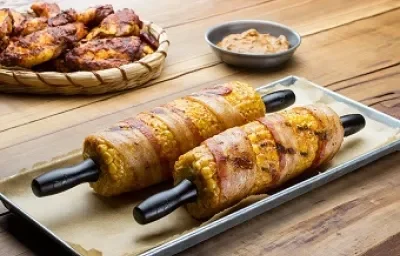 elotes envueltos con tocino